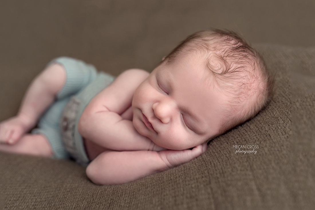 side resting newborn